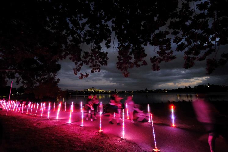 Hamilton’s Lake Rotoroa walkway is lit up for Te Ruru Light Festival. Image: Geoff Ridder.