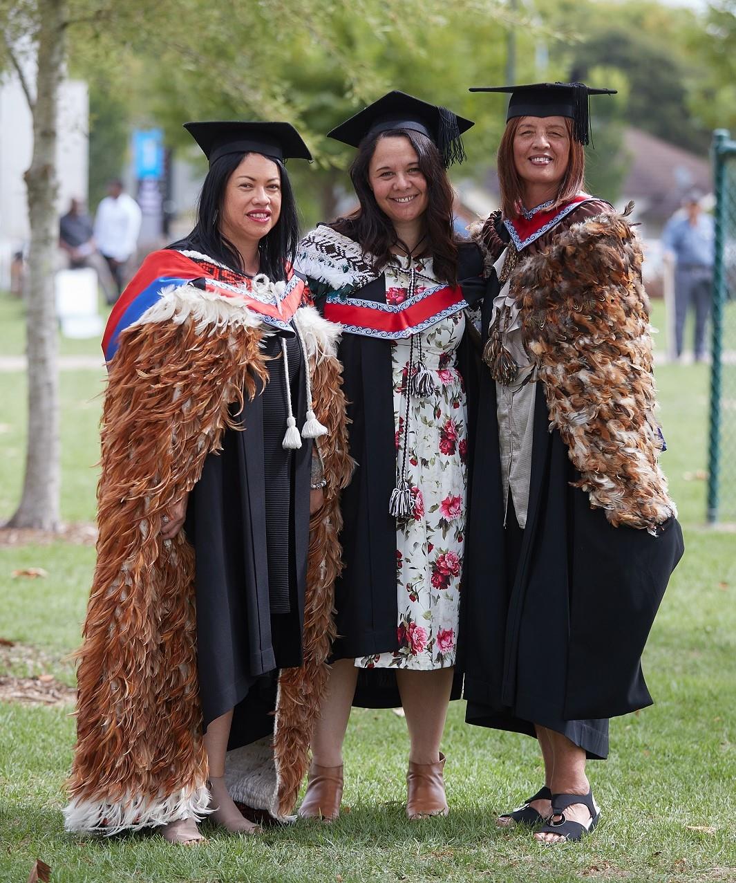 Wintec Māori Masters graduates Natalie Lewis, Janette Ngaheu and Myra Pourau at their graduation.