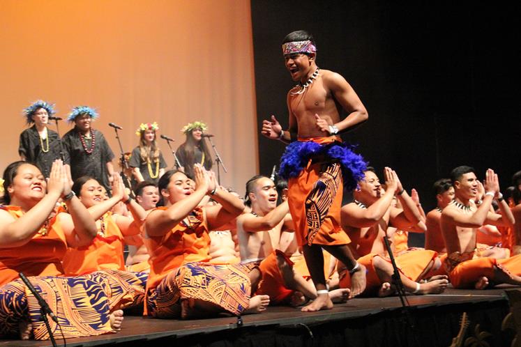 Norman Tofilau revs up the crowd and the performers in Pasifika by Nature at Fraser High School