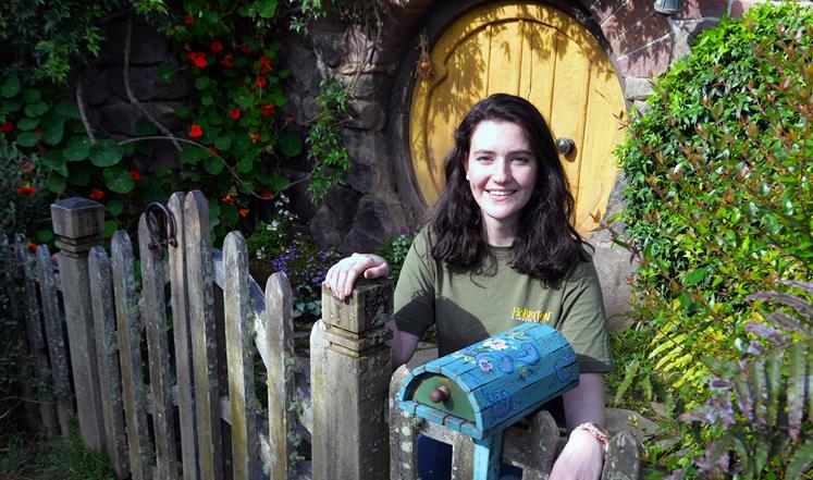 Wintec graduate Ruth Swartzberg with her latest creation: a painted Hobbit hole mailbox
