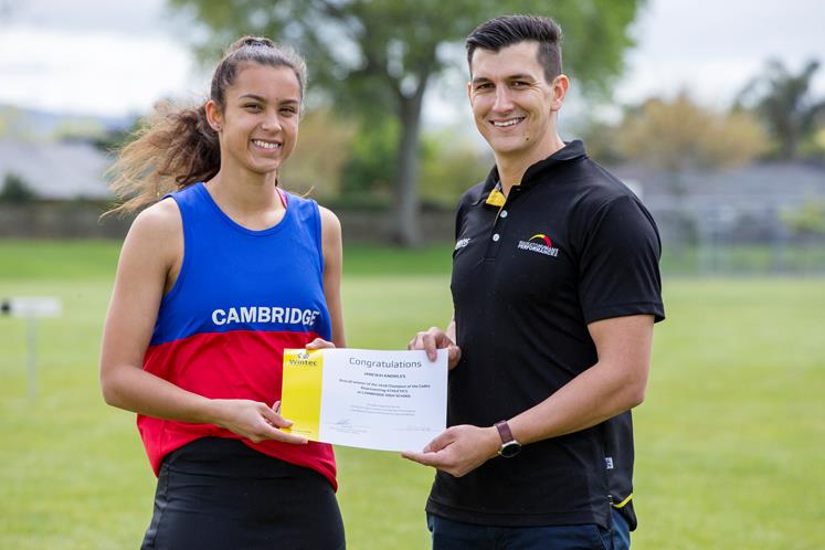 Winning athlete, Hinewai Knowles receives her  Champion of the Codes award from Wintec academic, Jako Bekker.