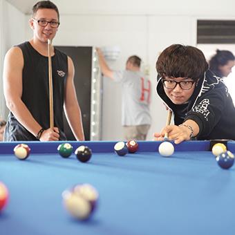 students playing pool in student accommodation