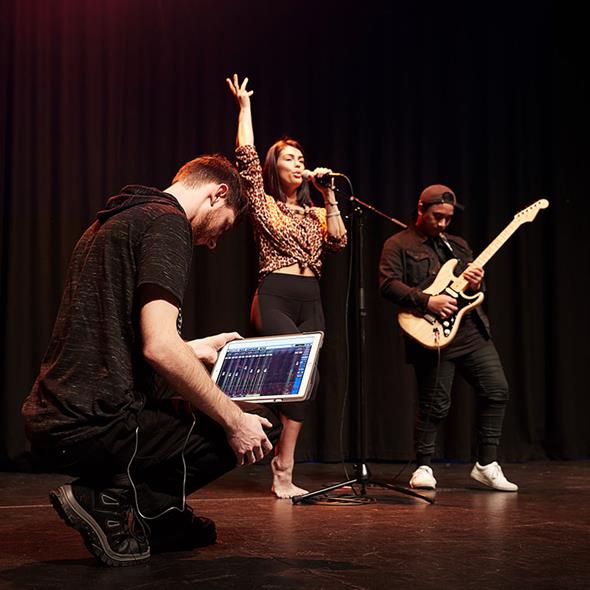 Music and performing arts students on stage