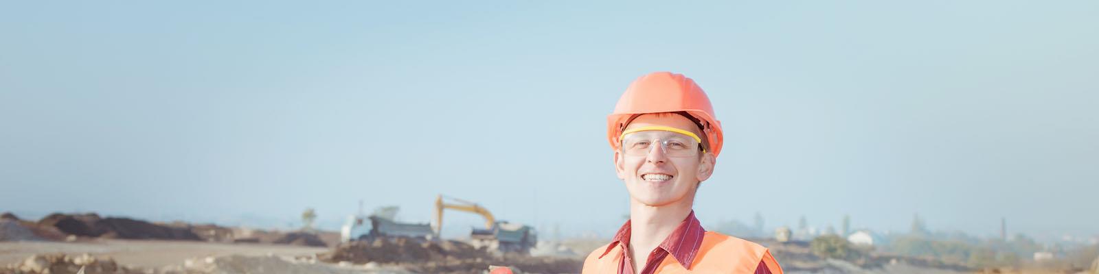 Civil engineer standing in front building construction