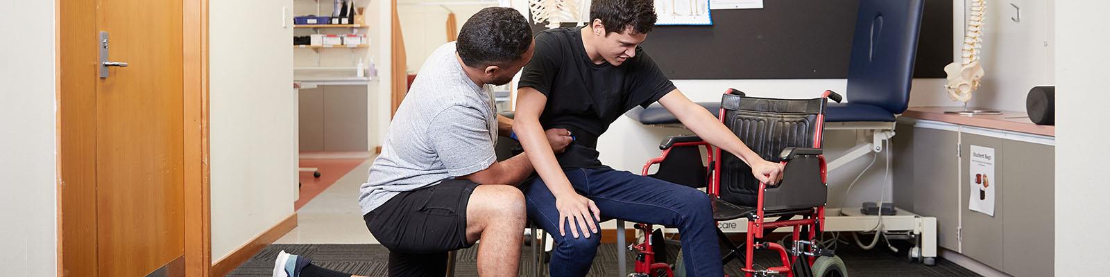 Physiotherapist working with client with mobility issues