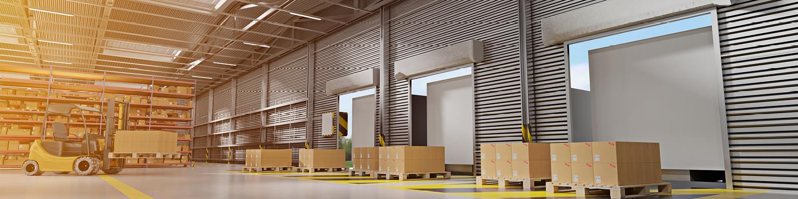 Interior shot of warehouse with forklift and stacked boxes