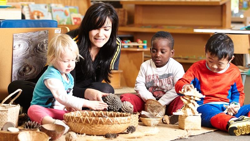 Early Childhood Education teacher working with children in a centre
